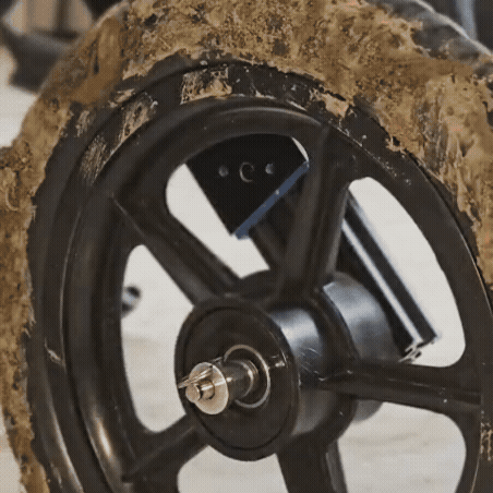 Swappable wheels on Sidekick dog wheelchair for indoor and outdoor use